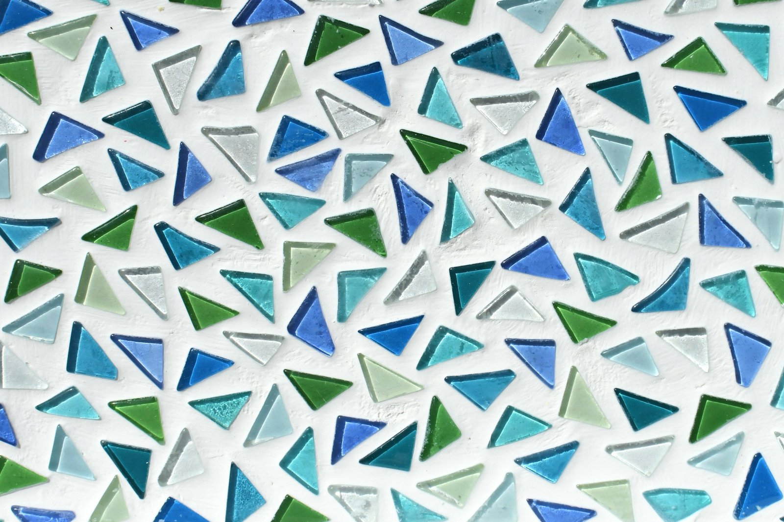Close up of sea glass mosaic tile in blue and green, full frame background